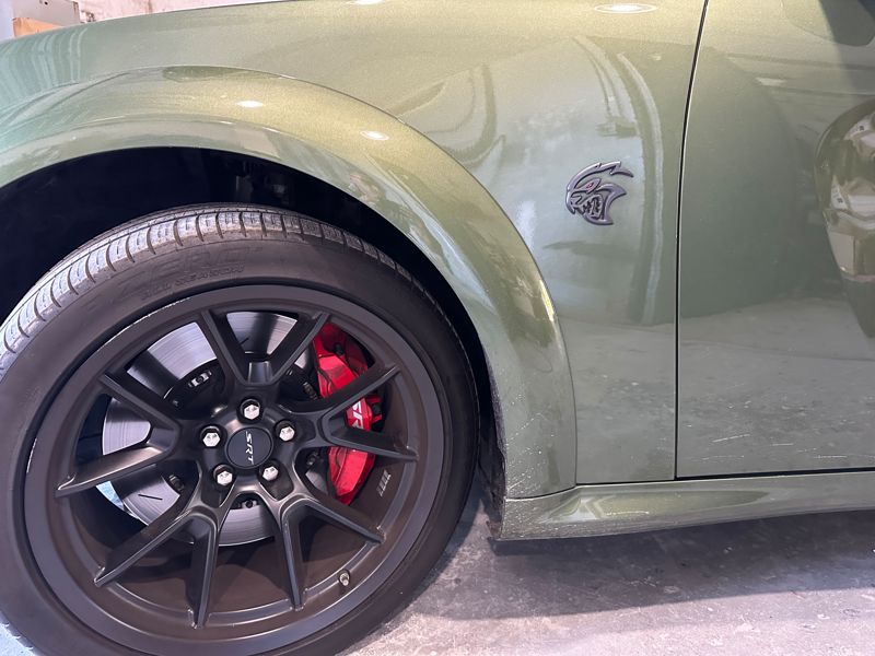 Wheel and brake caliper on a Dodge Charger in our shop